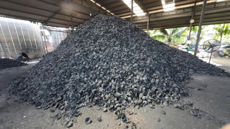 Loose coconut-shell charcoal stored in a KAOLA warehouse