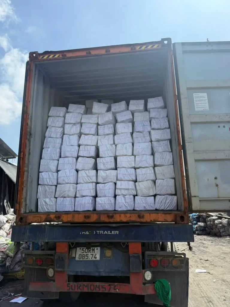 White-wrapped charcoal packages inside a container, from the KAOLA photo library